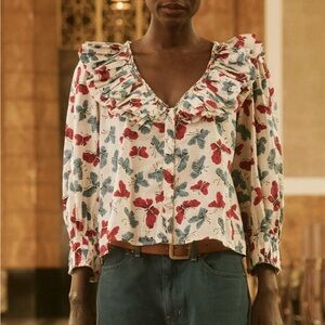 THE GREAT. Floral Ruffled V-Neck Blouse in White with Red & Blue Butterflies